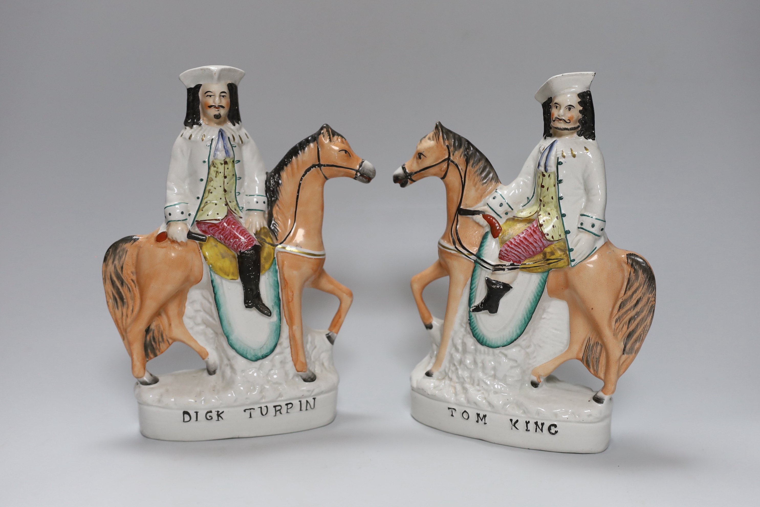 A pair of Victorian Staffordshire pottery flatback equestrian groups of Dick Turpin and Tom King, tallest 24cm high
